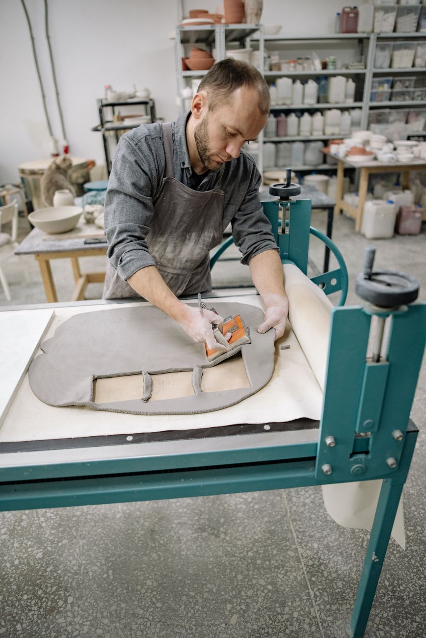 Artisan preparing ceramics in daylight studio